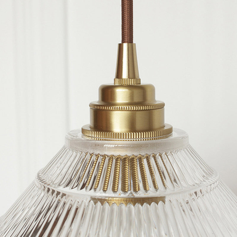 Enhance Your Dining Room with Industrial Elegance: The Brass Cone Pendant with Clear Ribbed Glass