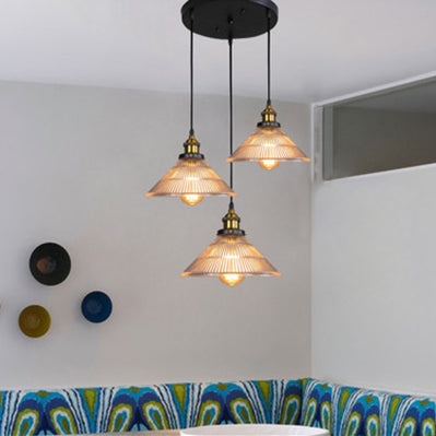 Illuminate Your Dining Room with Industrial Elegance: The 3-Light Brass Cone Pendant with Ribbed Glass