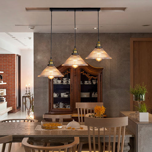Illuminate Your Dining Room with Industrial Elegance: The 3-Light Brass Cone Pendant with Ribbed Glass
