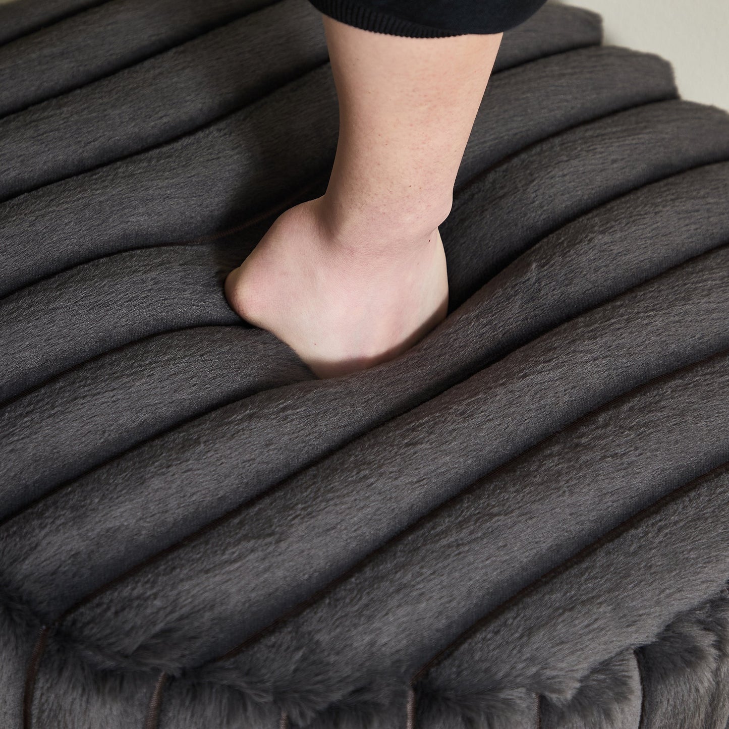 22.05' Wide Upholstered Round Pouf Ottoman Foot Rest with Black Metal Legs, Faux Fur Finish, Charcoal