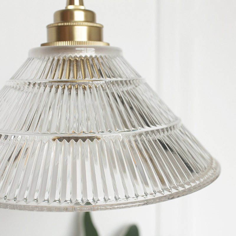 Enhance Your Dining Room with Industrial Elegance: The Brass Cone Pendant with Clear Ribbed Glass