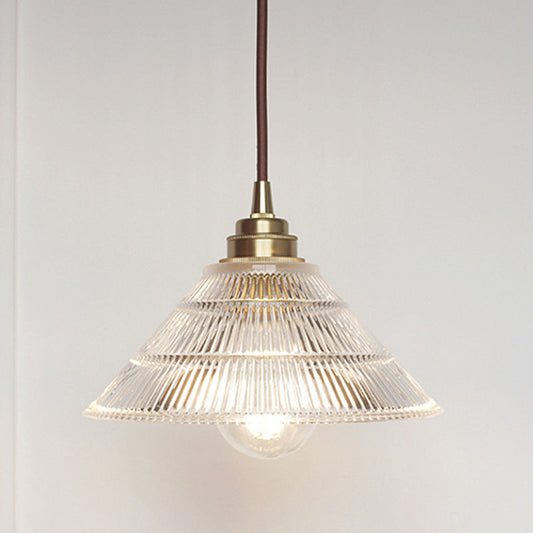 Enhance Your Dining Room with Industrial Elegance: The Brass Cone Pendant with Clear Ribbed Glass