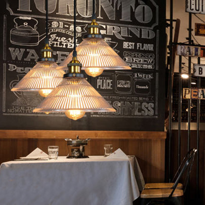 Illuminate Your Dining Room with Industrial Elegance: The 3-Light Brass Cone Pendant with Ribbed Glass