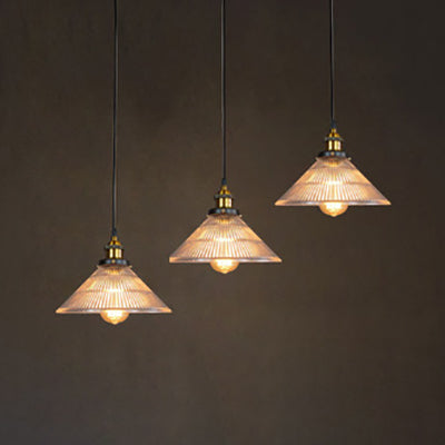 Illuminate Your Dining Room with Industrial Elegance: The 3-Light Brass Cone Pendant with Ribbed Glass