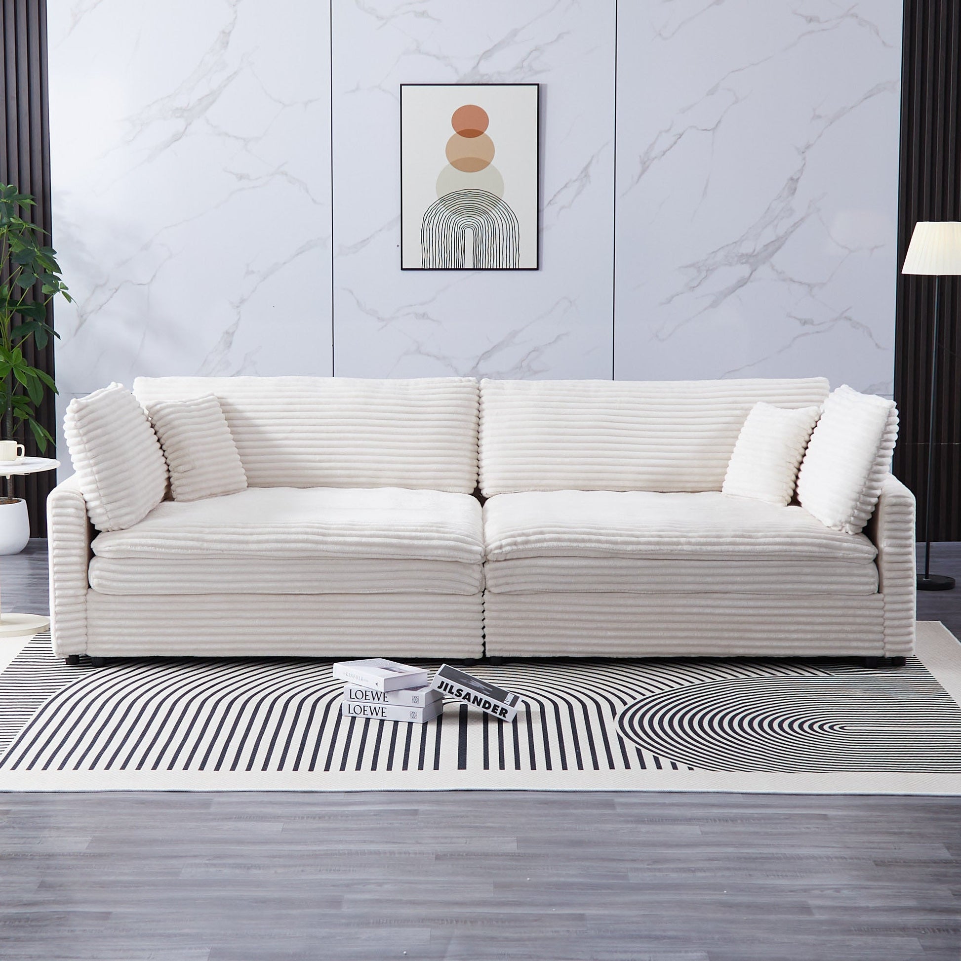 Area Rug: The 112-inch beige corduroy sofa, with two throw pillows and four backrests, has opened up a new style for the living room's leisure area by Streamdale Furniture