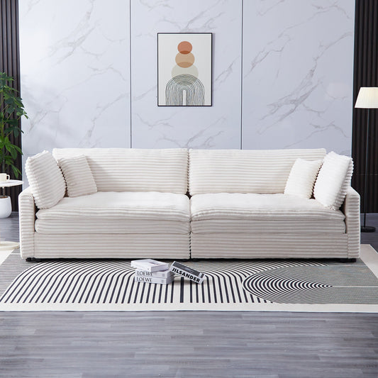Area Rug: The 112-inch beige corduroy sofa, with two throw pillows and four backrests, has opened up a new style for the living room's leisure area by Streamdale Furniture